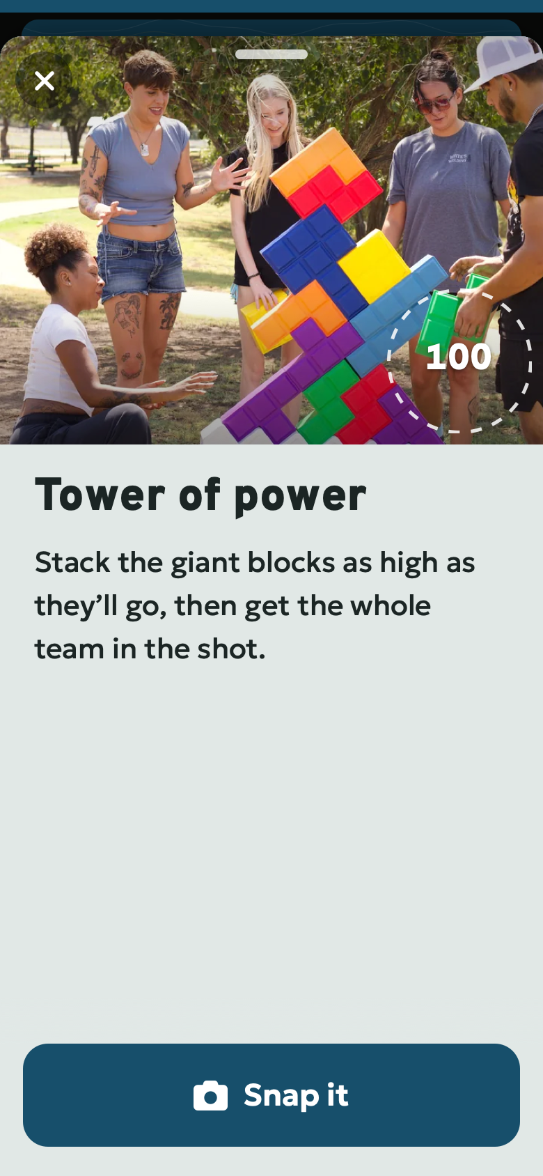 Snap it: Tower of power. Stack the giant blocks as high as they’ll go, then get the whole team in the shot. Poster preview of the Passport challenge screen.